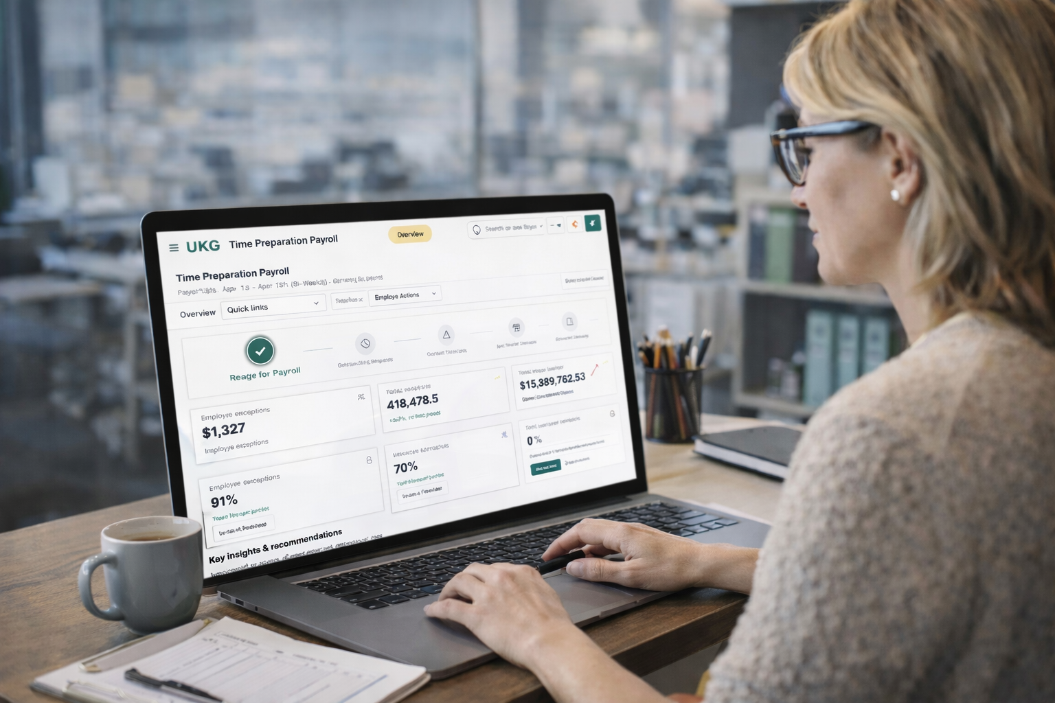 Payroll administrator reviewing the unified Time Preparation Payroll dashboard on a laptop